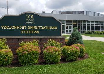 Sign for the Manufacturing Technology Institute displayed prominently in front of the building.